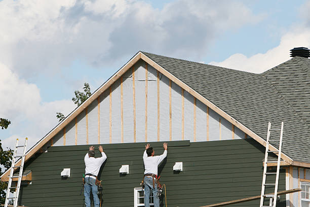 Professional Storm Damage Siding Repair technician working in Liberty, NC